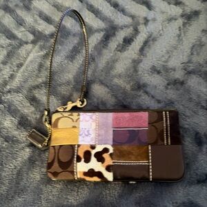 Gentle used Coach Wristlet with Animal Print and Purple Accents pouch